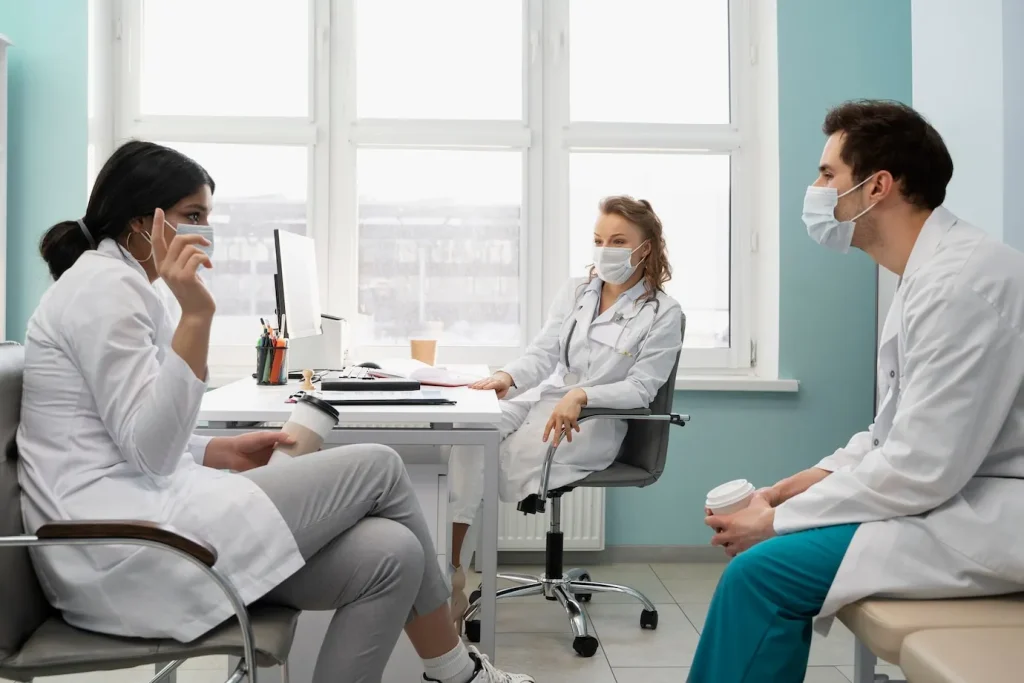 team meeting between a Primary Care Physician and Pain Specialist