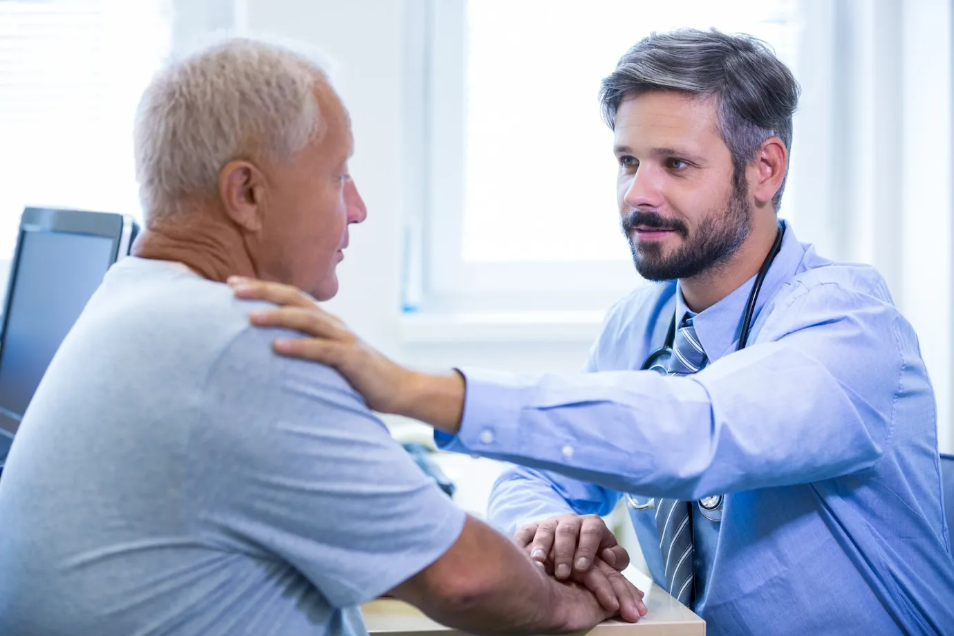 doctor helping patient in pain management